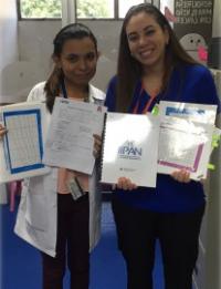 IIPAN members showing IIPAN booklets